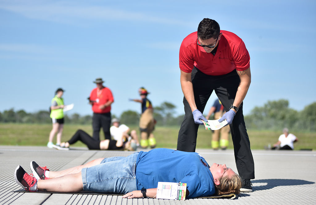 University of Missouri paramedic Evan Busen examines the extent of the "injuries" on Ashly Newlon